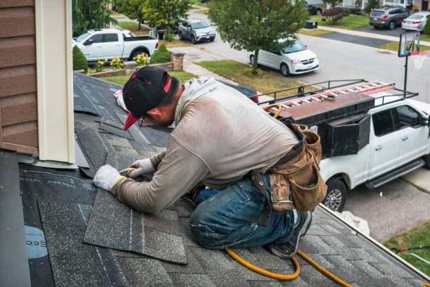 Professional Roofing technician working in Roggen, CO